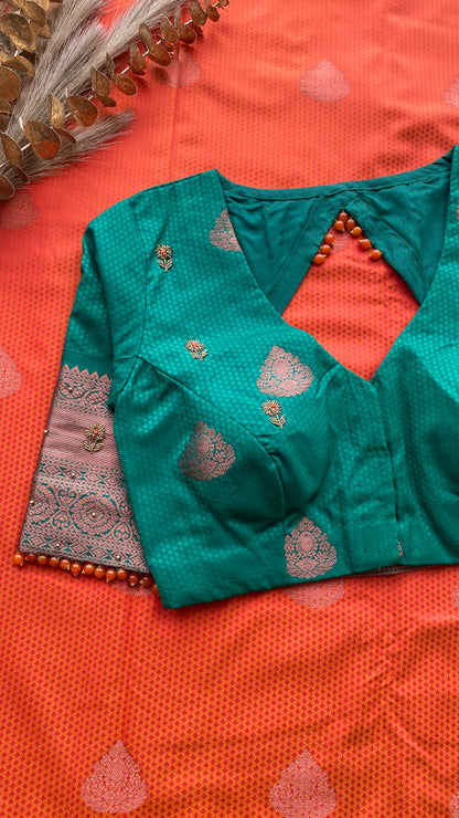 Orange and green silk saree with hand work blouse