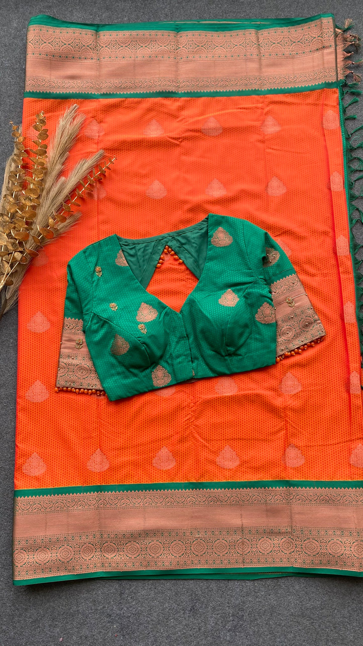 Orange and green silk saree with hand work blouse