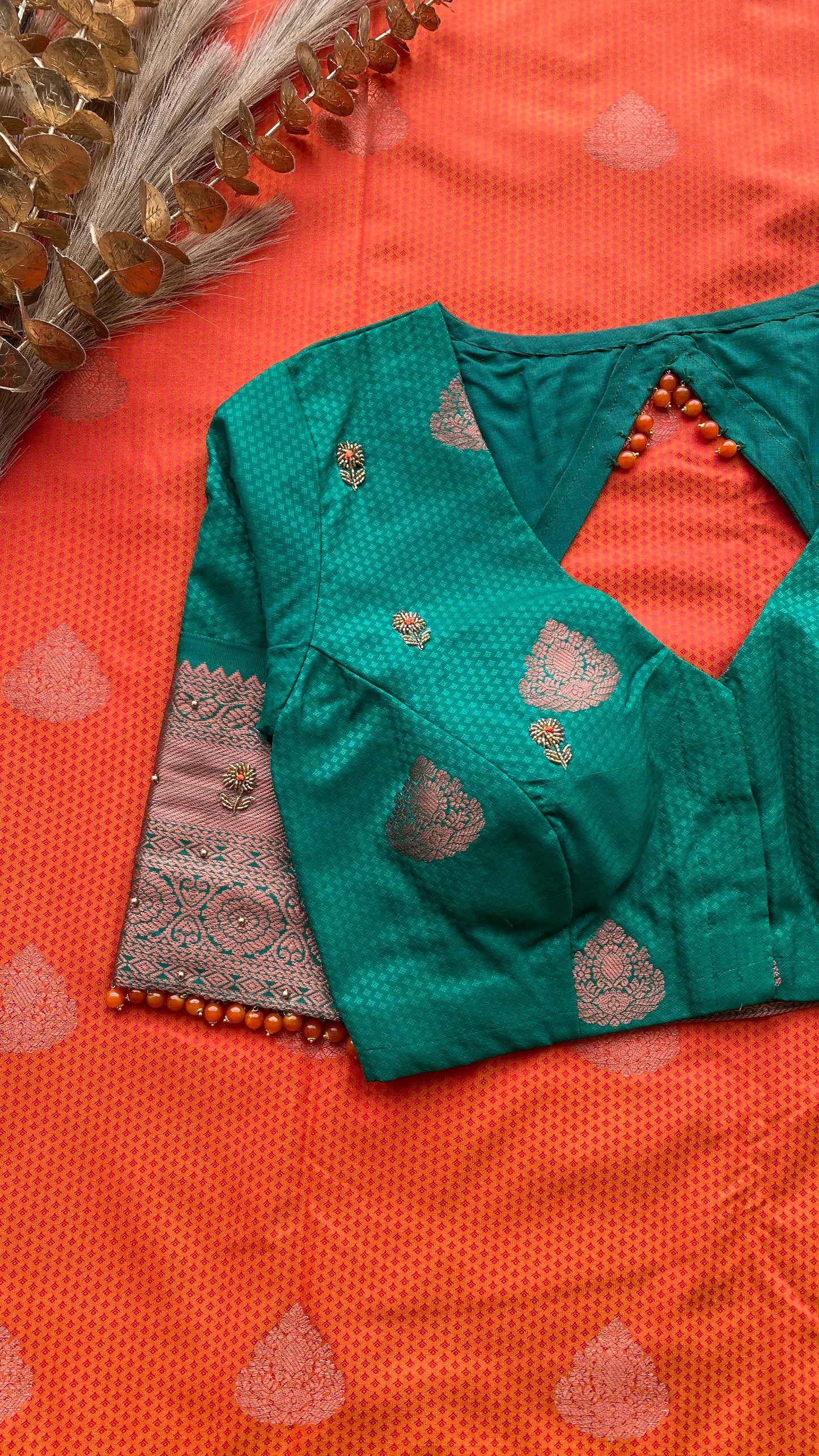 Orange and green silk saree with hand work blouse