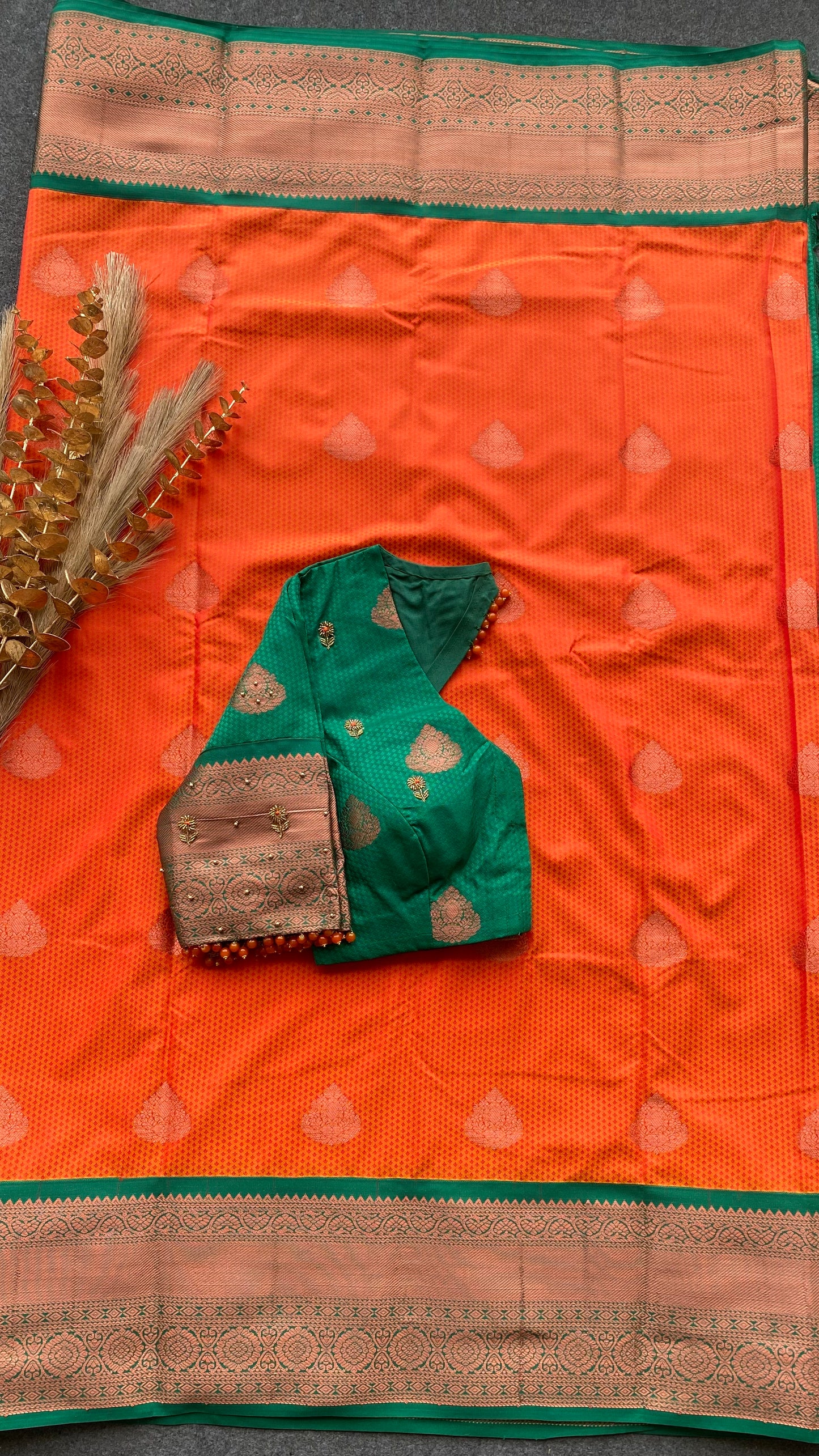 Orange and green silk saree with hand work blouse