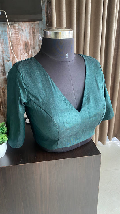 Bottle green silk V neck patterned blouse