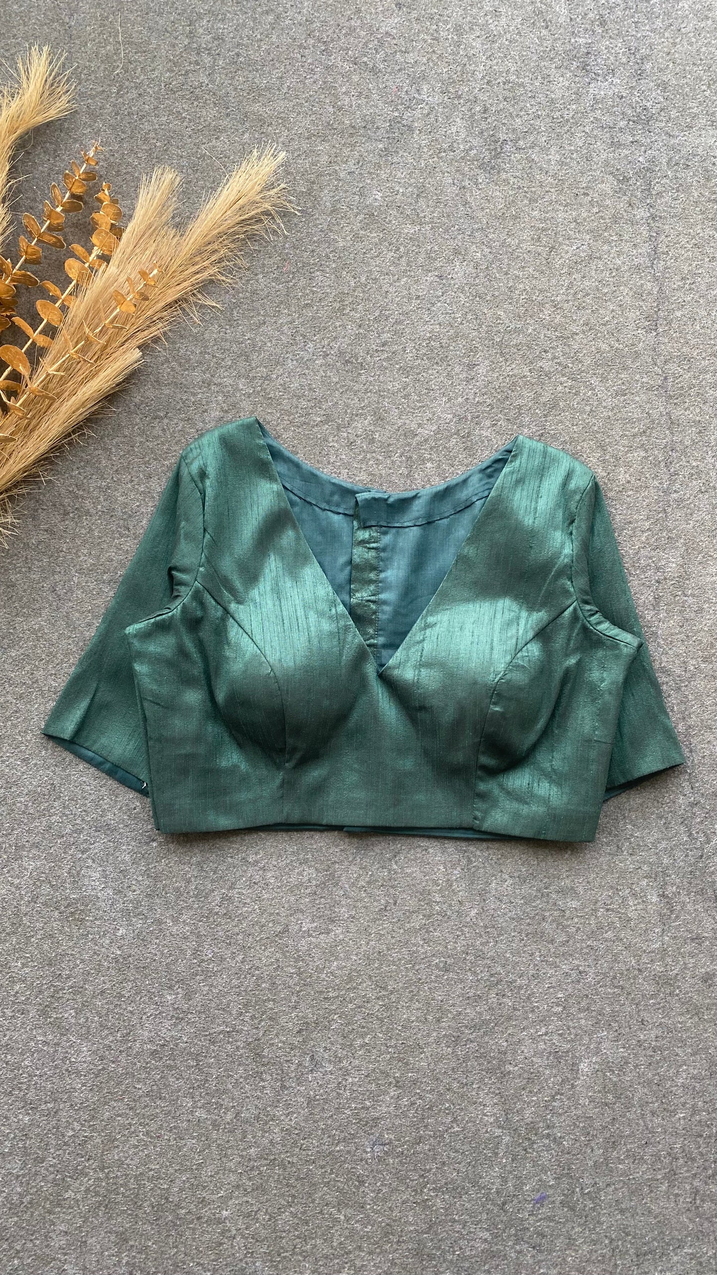 Bottle green silk V neck patterned blouse