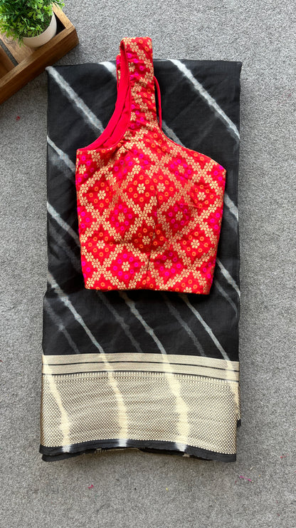 Black organza saree with red bandhini blouse