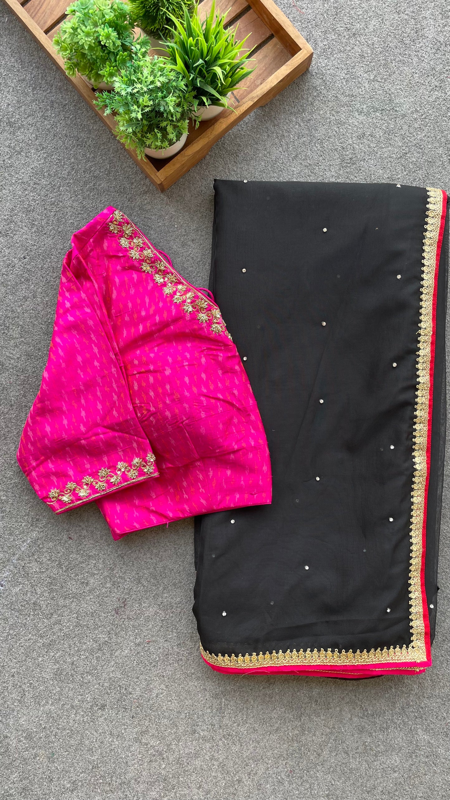 Black organza saree with pink ikkat blouse