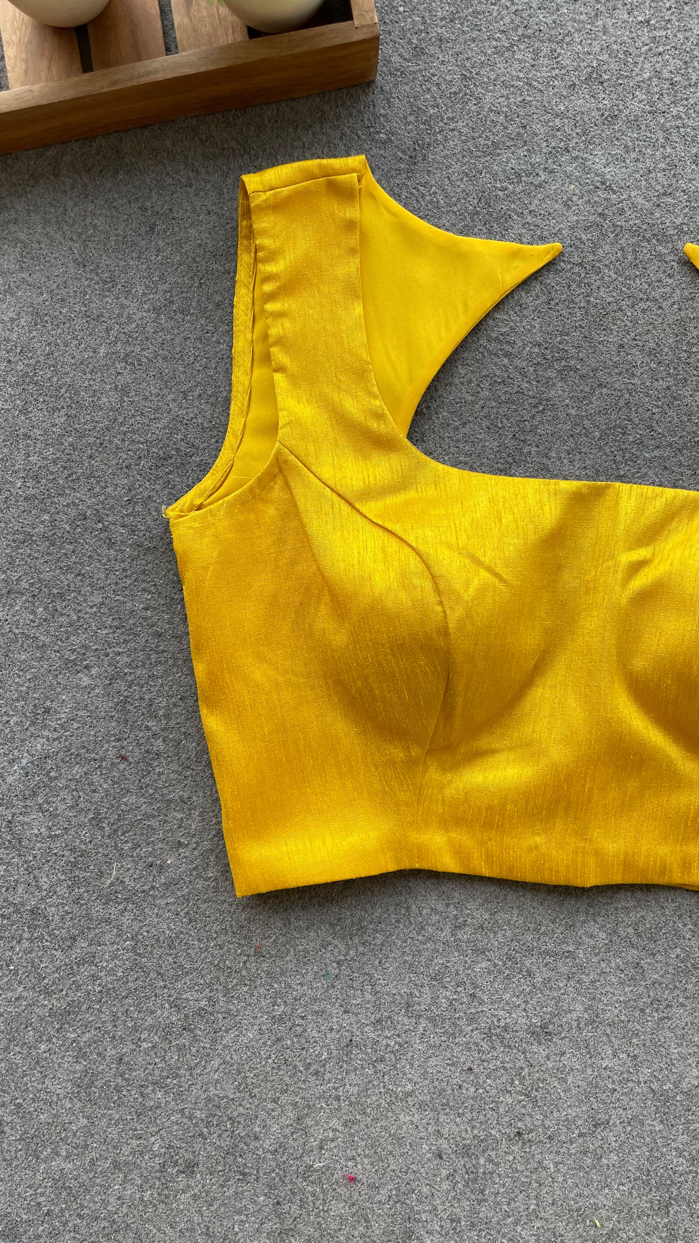 Yellow silk sleeveless blouse