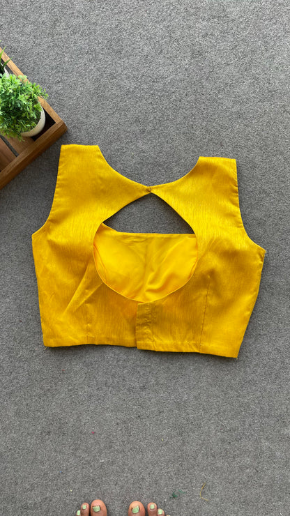 Yellow silk sleeveless blouse