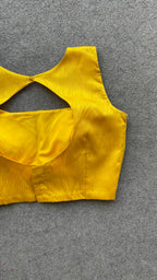 Yellow silk sleeveless blouse