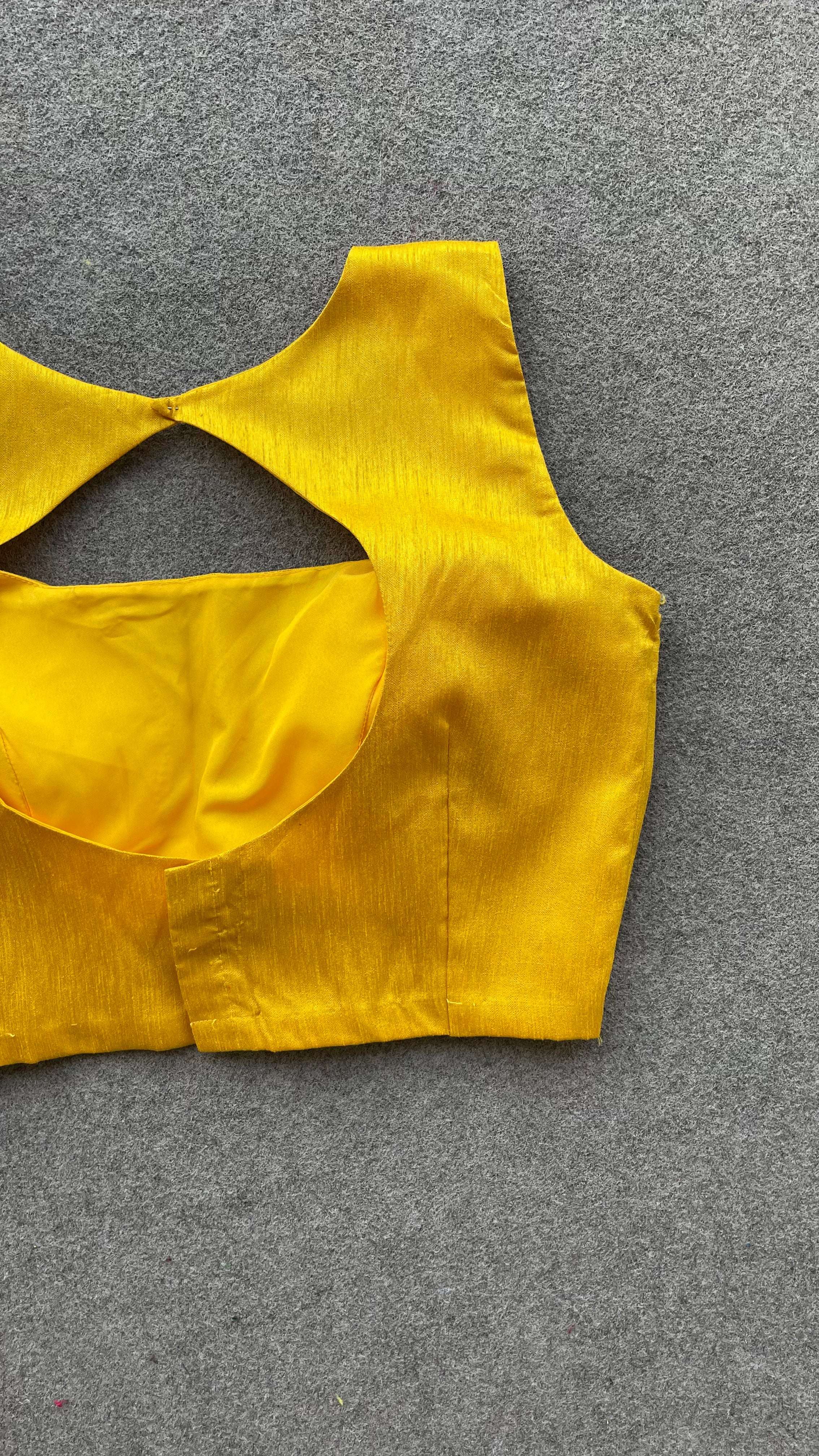 Yellow silk sleeveless blouse