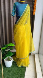 Yellow organza checked saree with handwork blouse