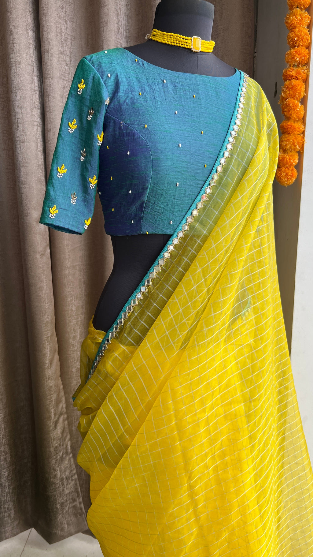 Yellow organza checked saree with handwork blouse
