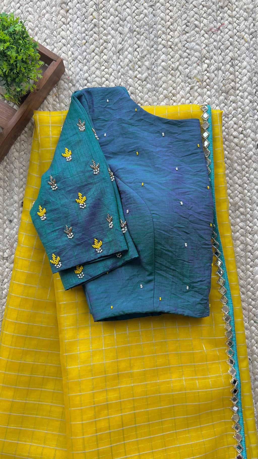 Yellow organza checked saree with handwork blouse
