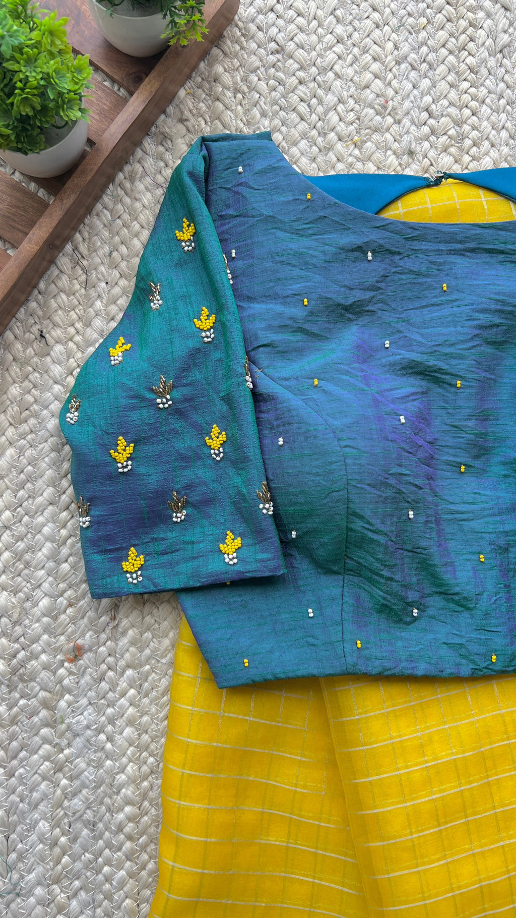 Yellow organza checked saree with handwork blouse