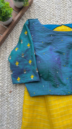 Yellow organza checked saree with handwork blouse