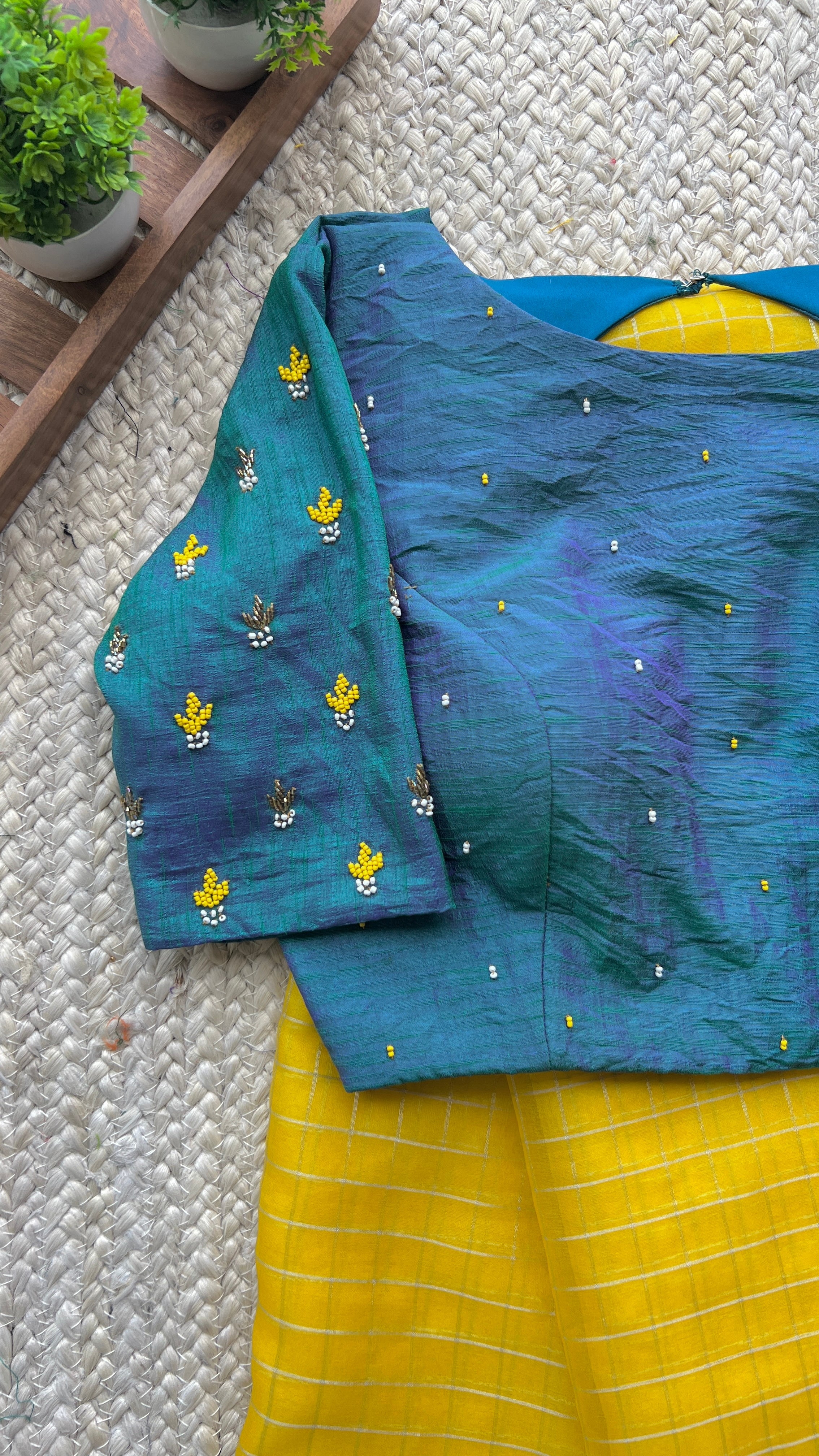 Yellow organza checked saree with handwork blouse