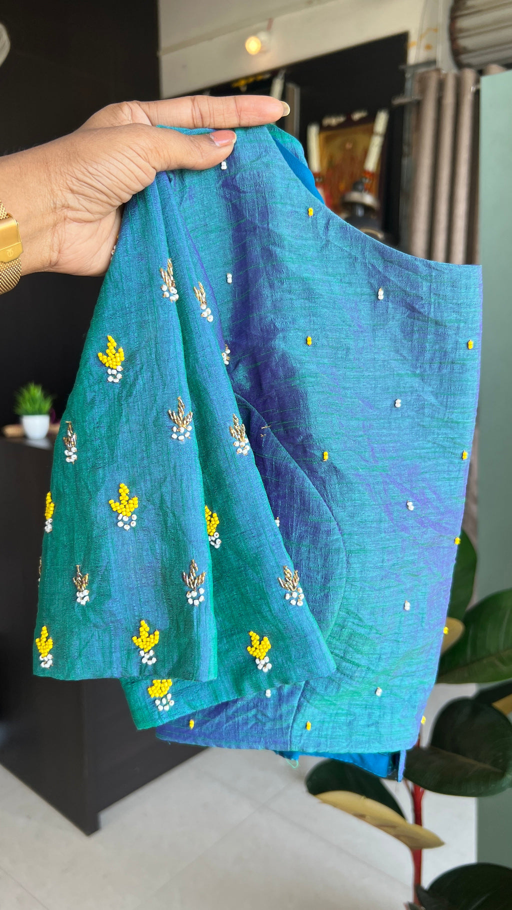 Yellow organza checked saree with handwork blouse