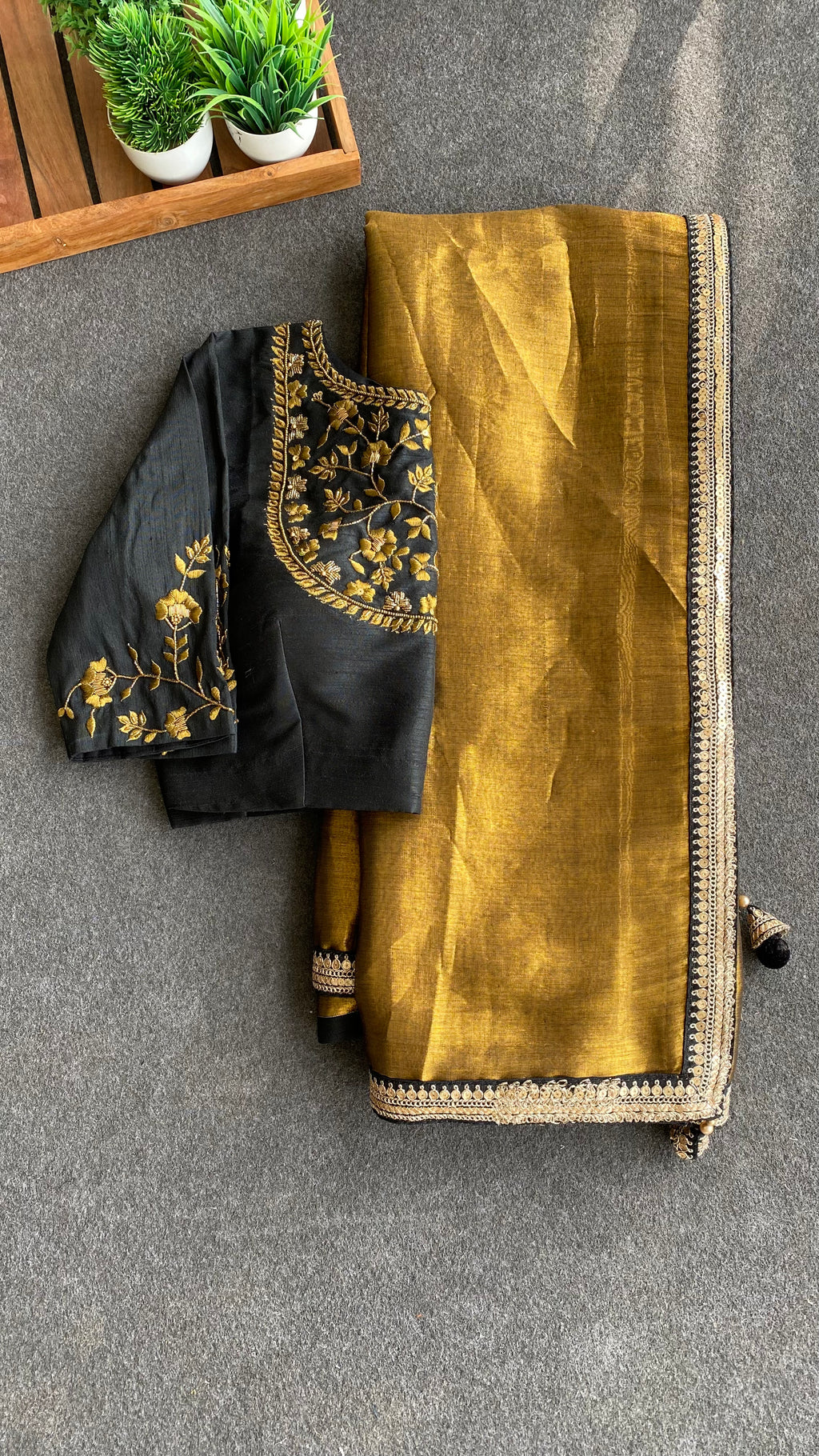 Gold tissue saree with black hand worked blouse