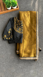 Gold tissue saree with black hand worked blouse