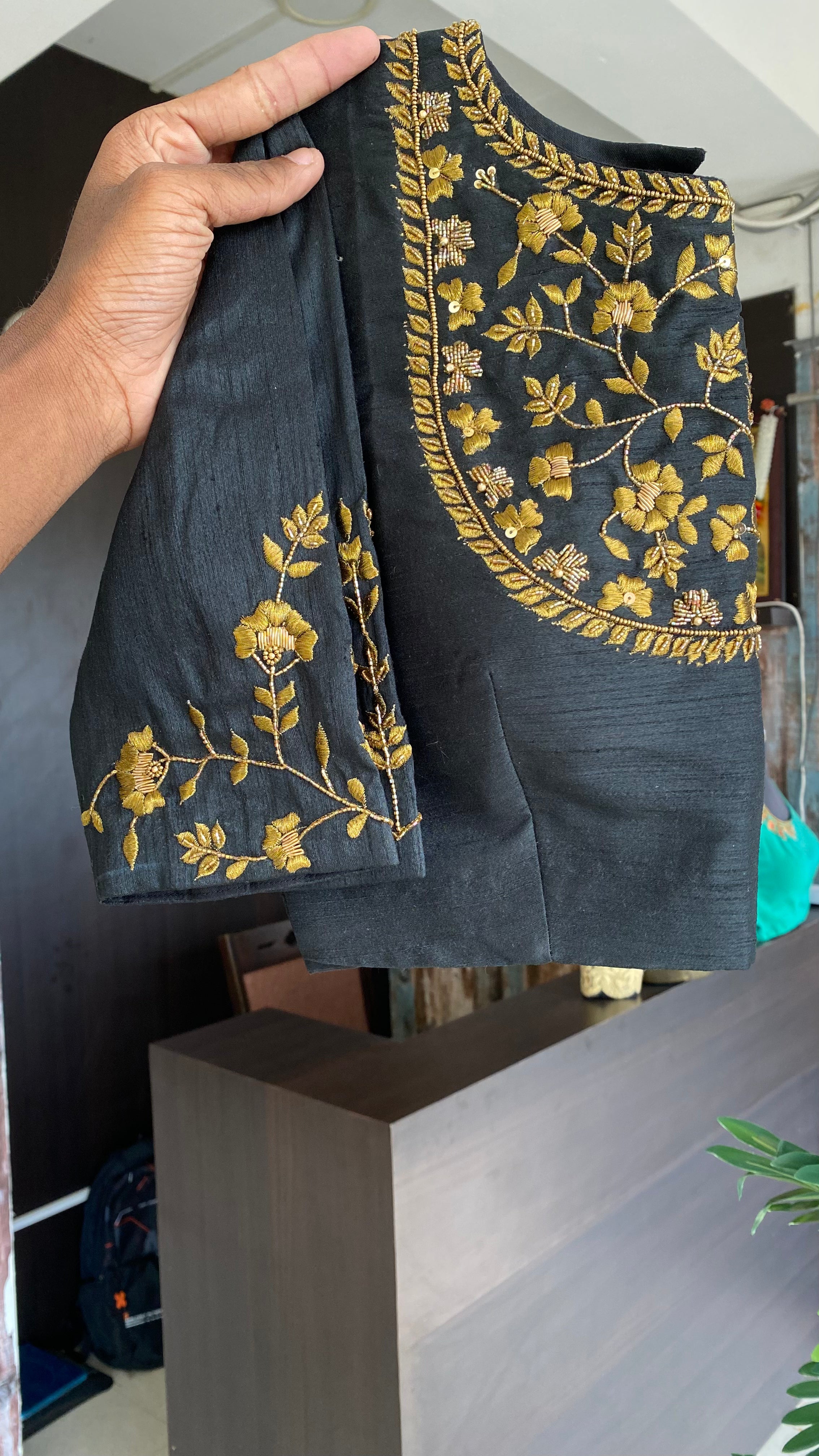 Gold tissue saree with black hand worked blouse