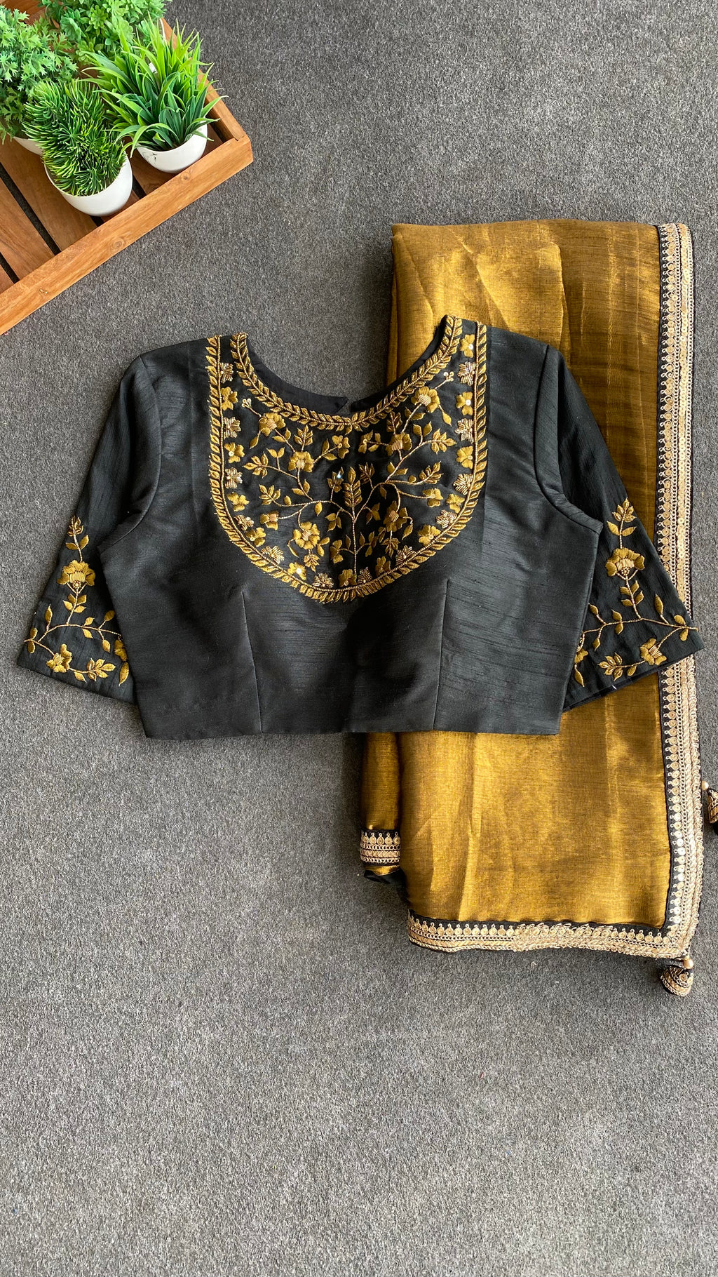 Gold tissue saree with black hand worked blouse