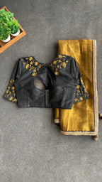 Gold tissue saree with black hand worked blouse