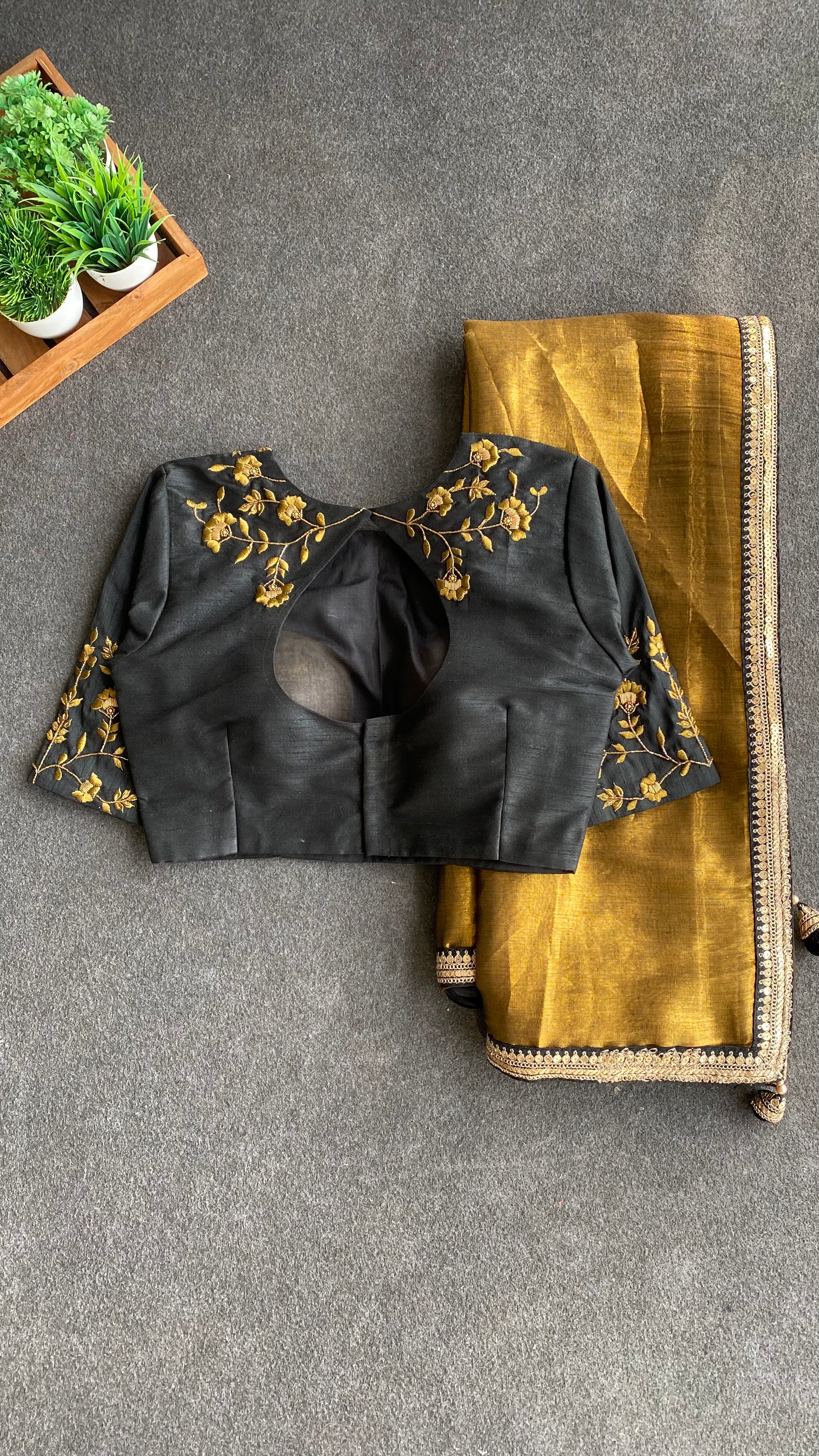 Gold tissue saree with black hand worked blouse