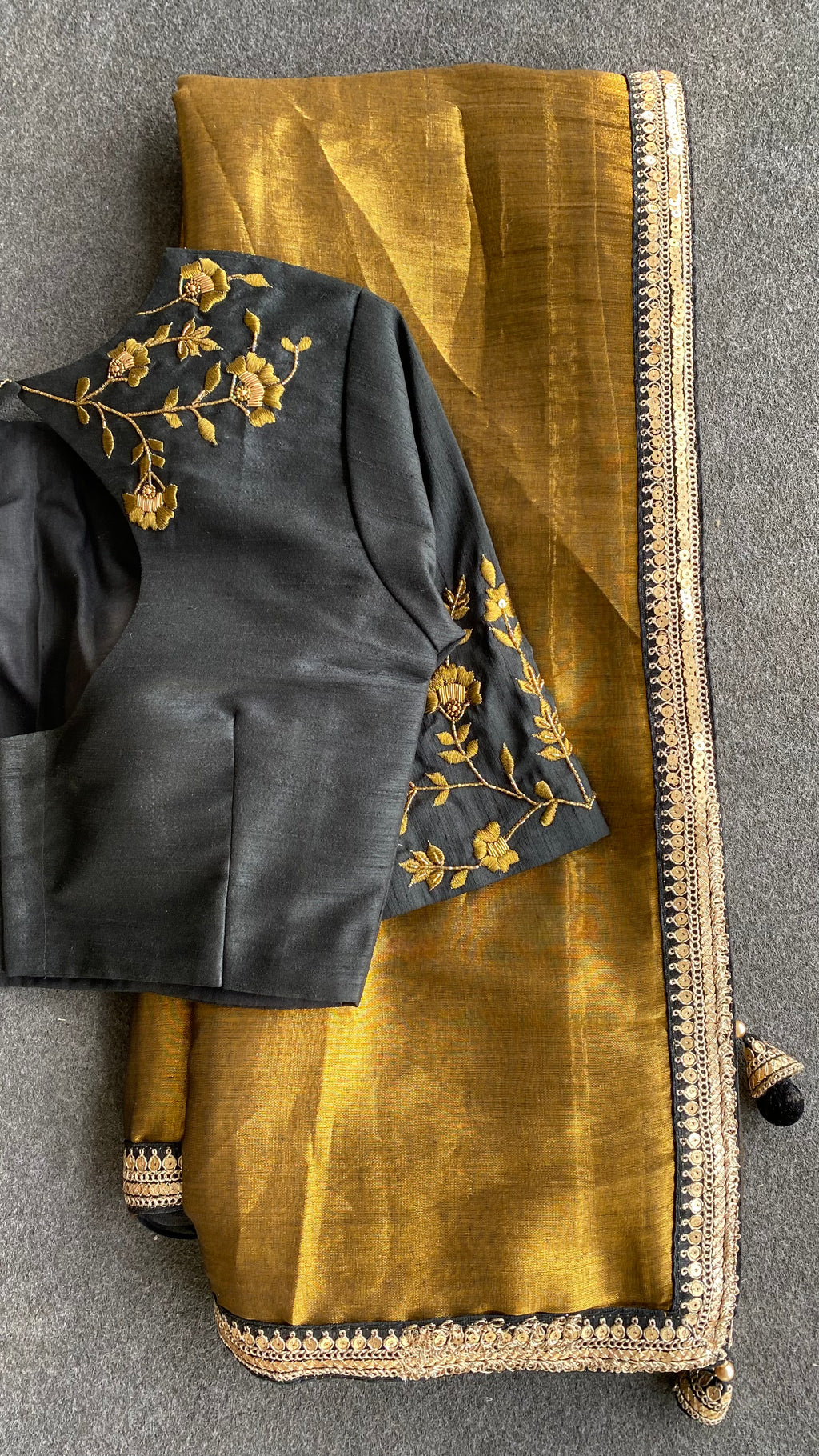 Gold tissue saree with black hand worked blouse