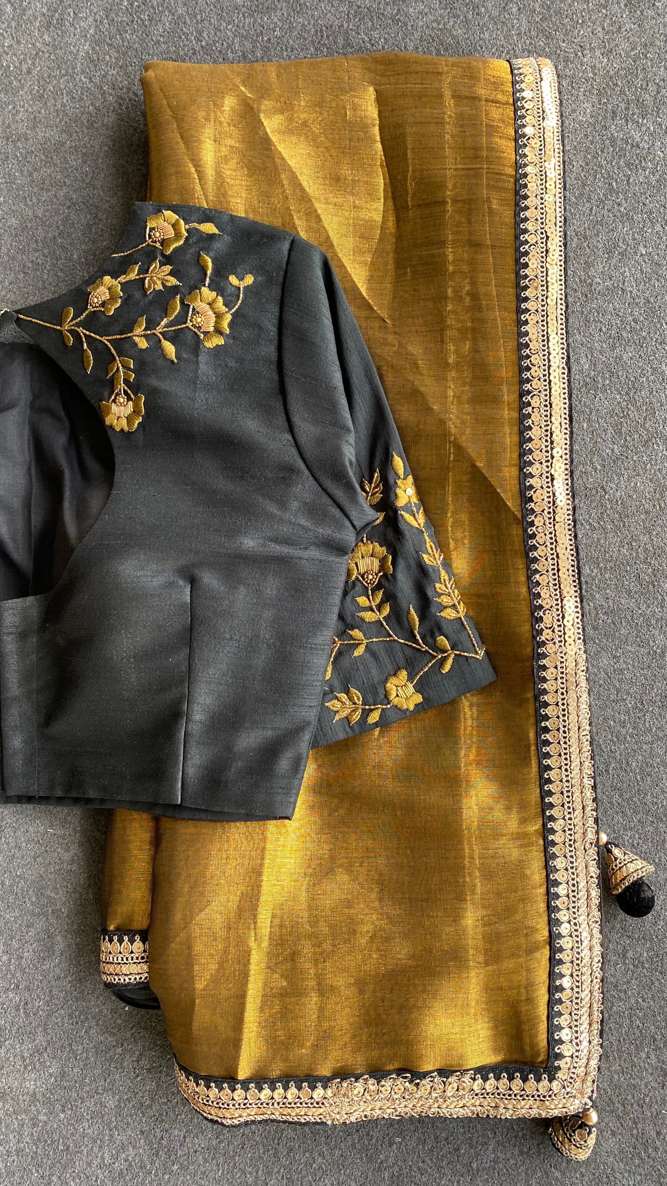 Gold tissue saree with black hand worked blouse