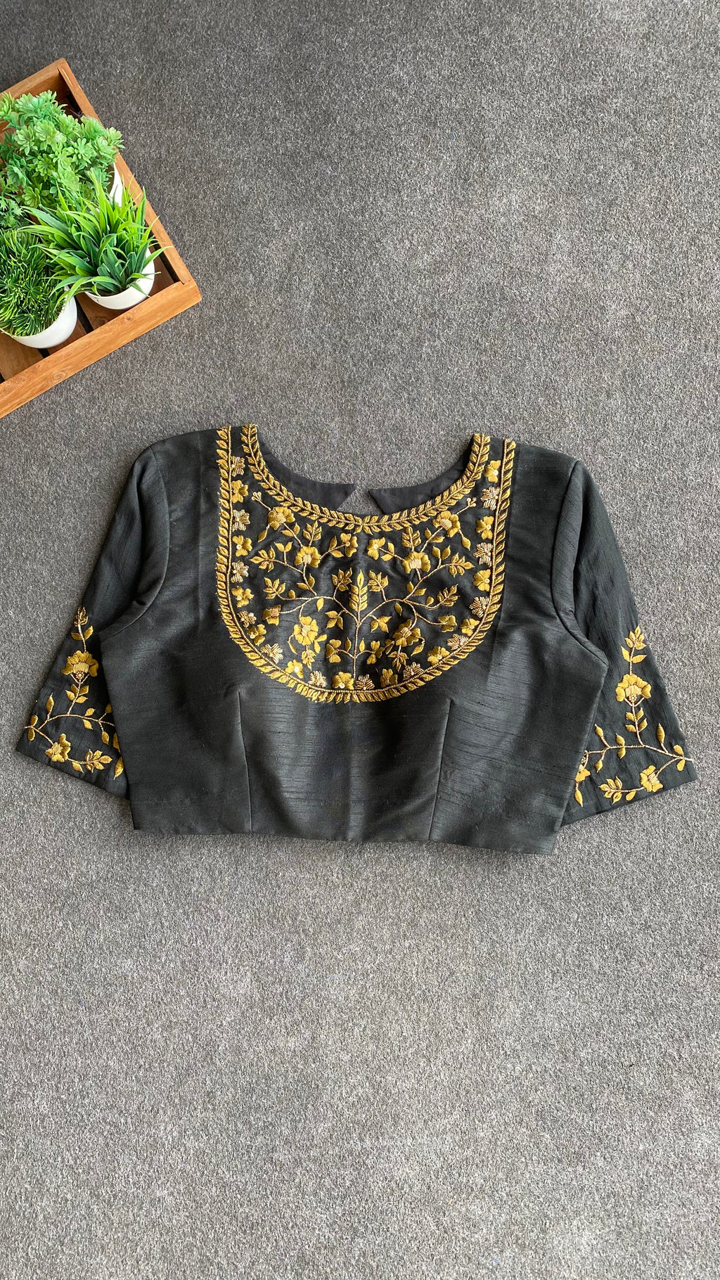 Gold tissue saree with black hand worked blouse