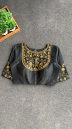 Gold tissue saree with black hand worked blouse