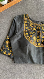 Gold tissue saree with black hand worked blouse