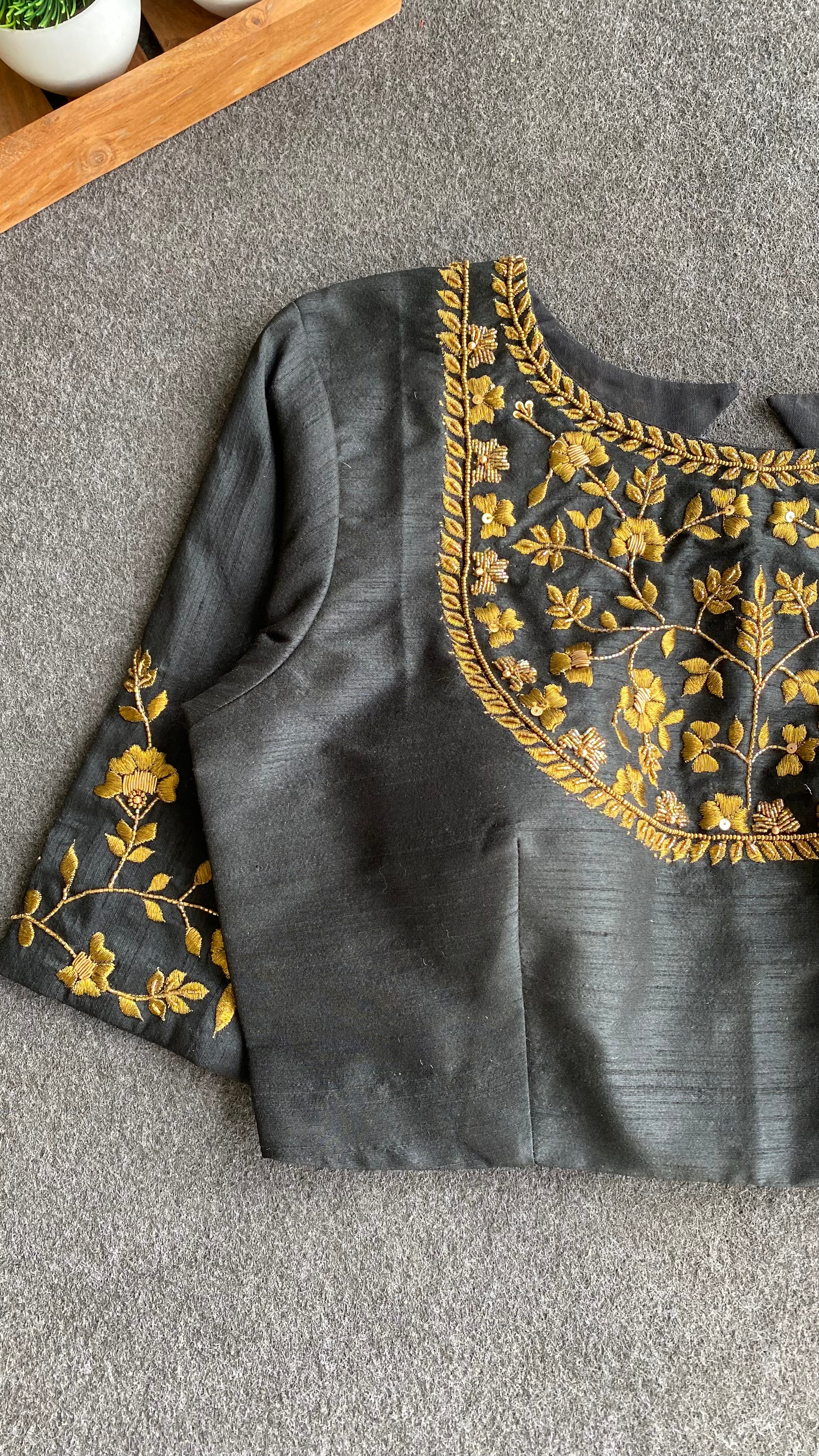 Gold tissue saree with black hand worked blouse