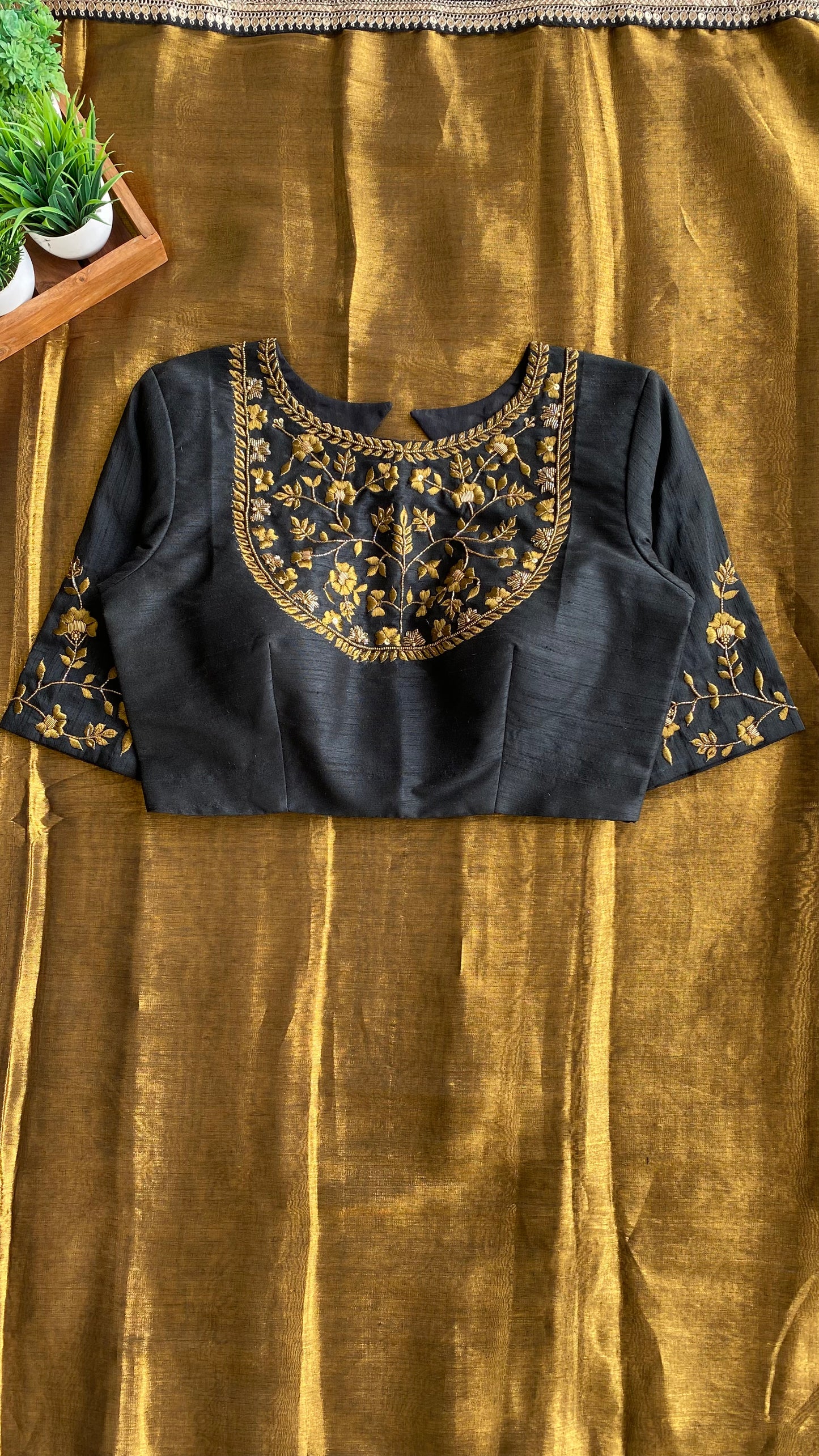 Gold tissue saree with black hand worked blouse
