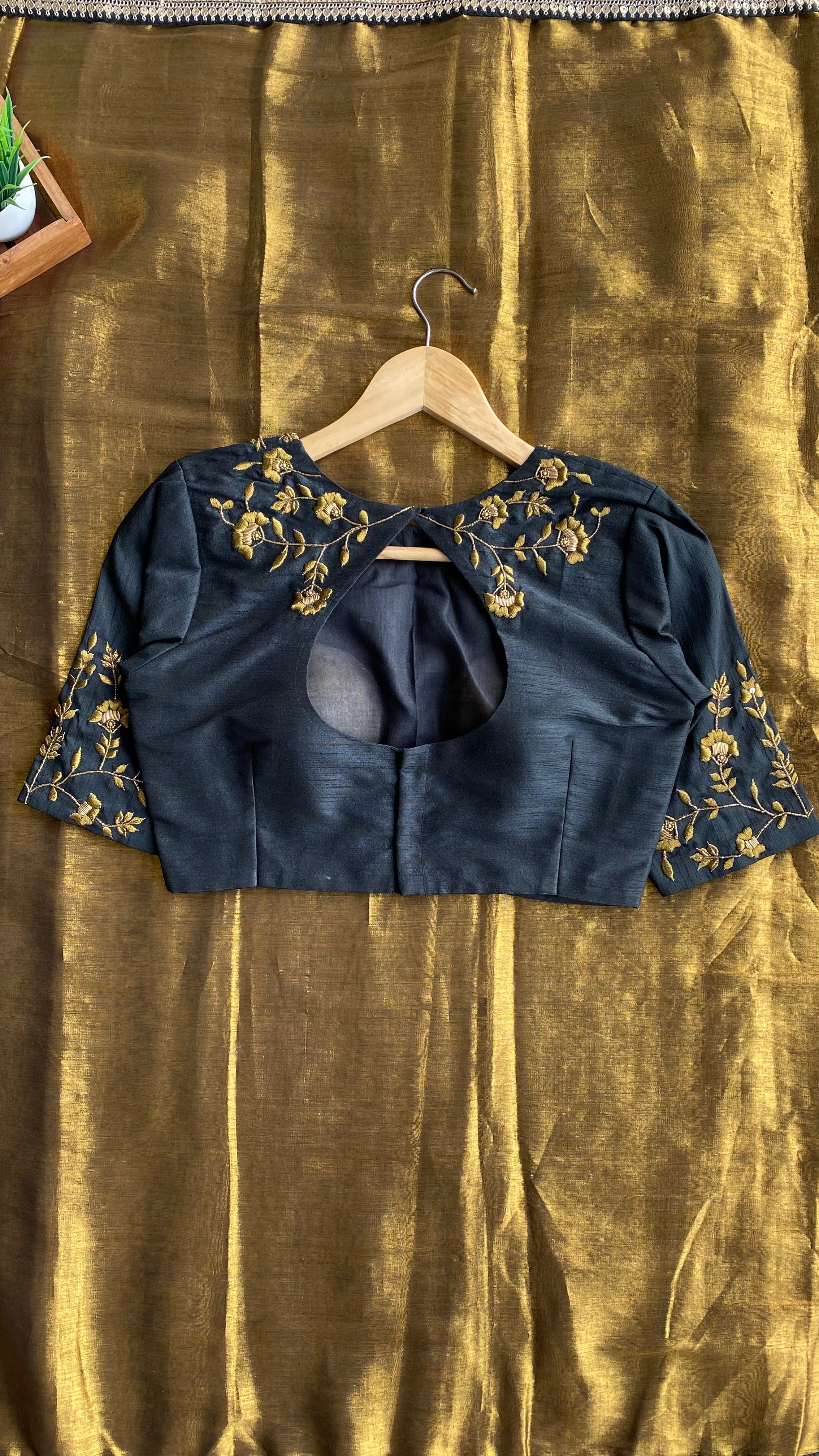 Gold tissue saree with black hand worked blouse