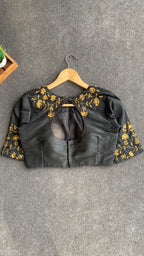 Gold tissue saree with black hand worked blouse