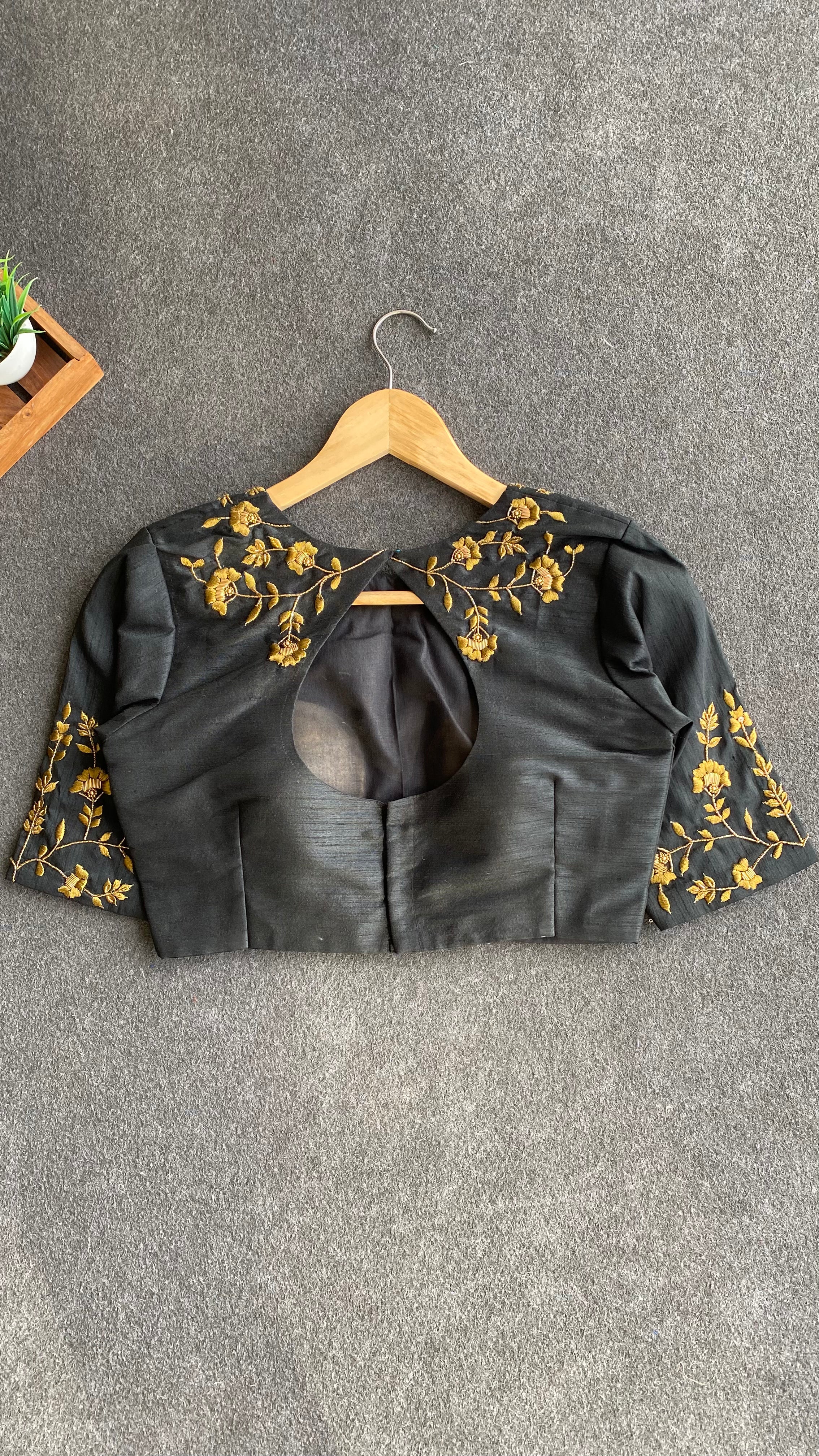 Gold tissue saree with black hand worked blouse