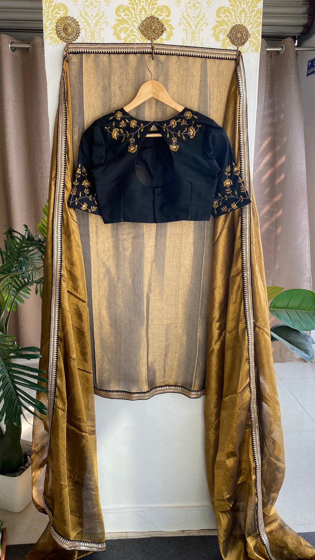 Gold tissue saree with black hand worked blouse