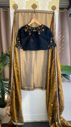 Gold tissue saree with black hand worked blouse