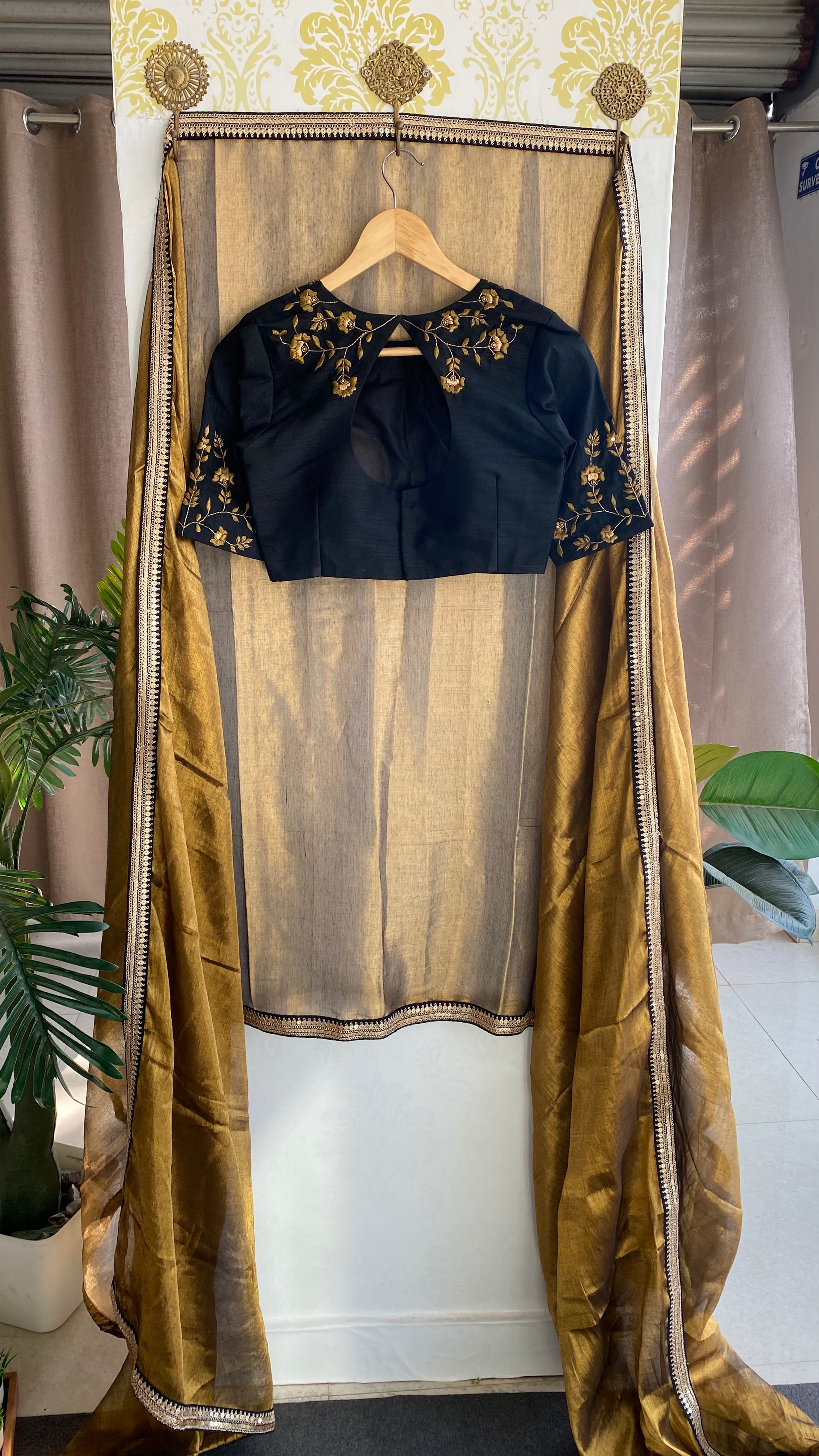 Gold tissue saree with black hand worked blouse