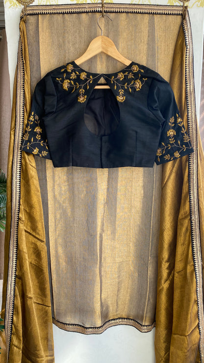 Gold tissue saree with black hand worked blouse