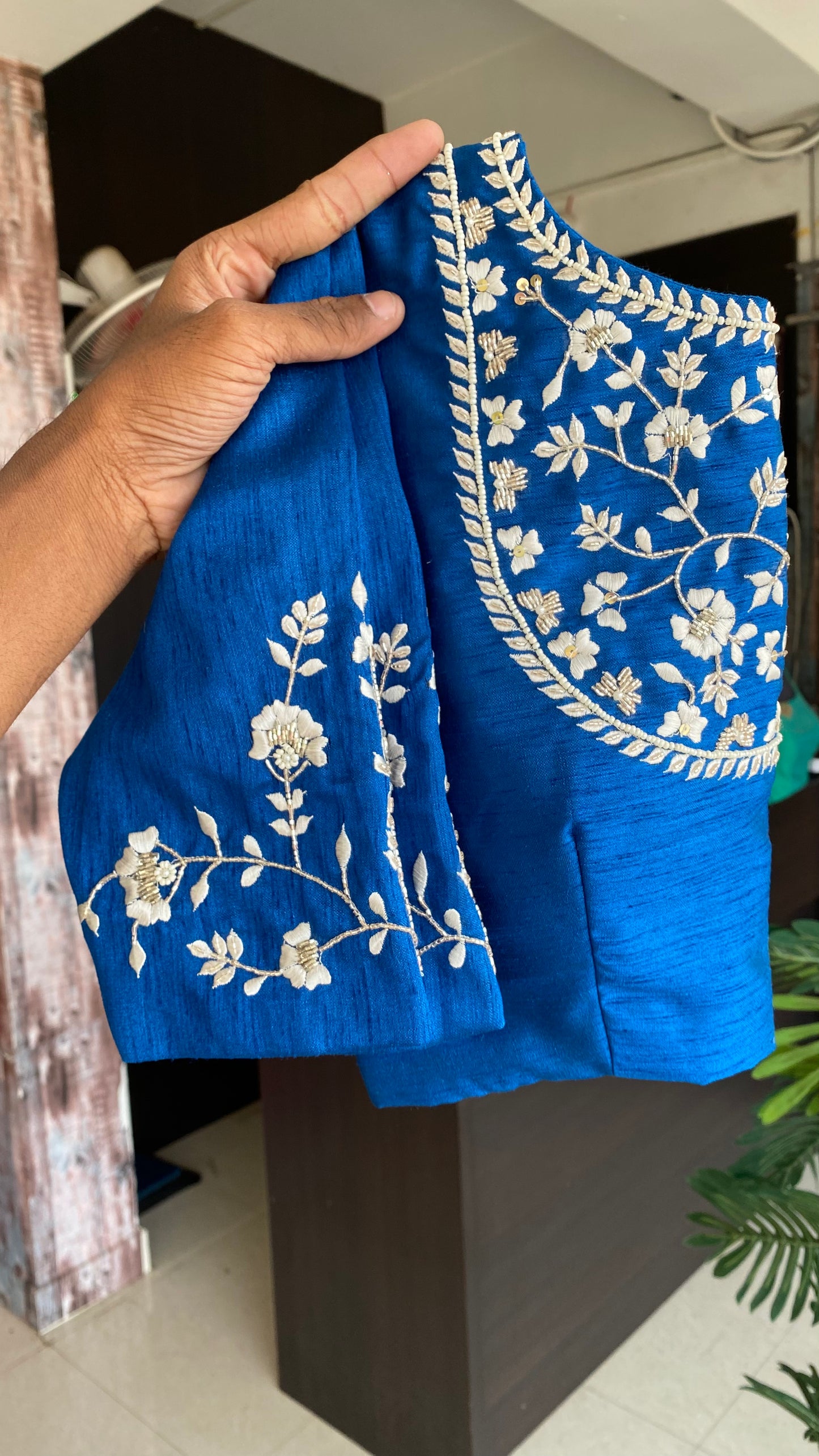 Half-white Blue floral organza saree with brown hand worked blouse