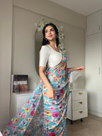 Blue floral chinnon saree with pearl hand work blouse