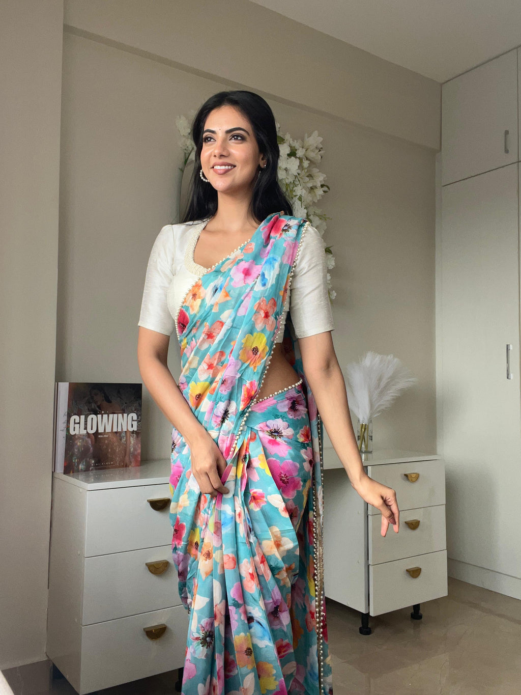 Blue floral chinnon saree with pearl hand work blouse