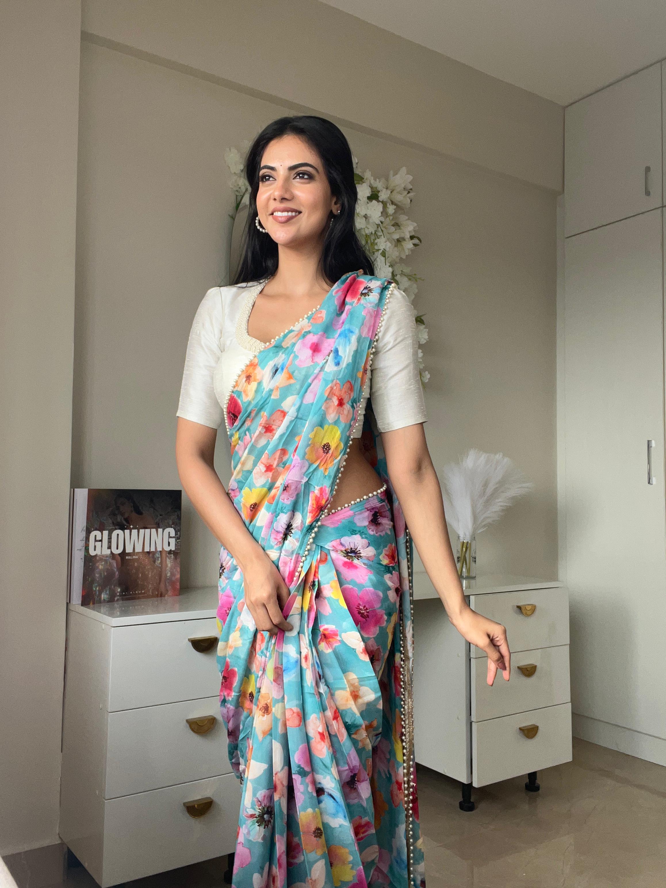 Blue floral chinnon saree with pearl hand work blouse