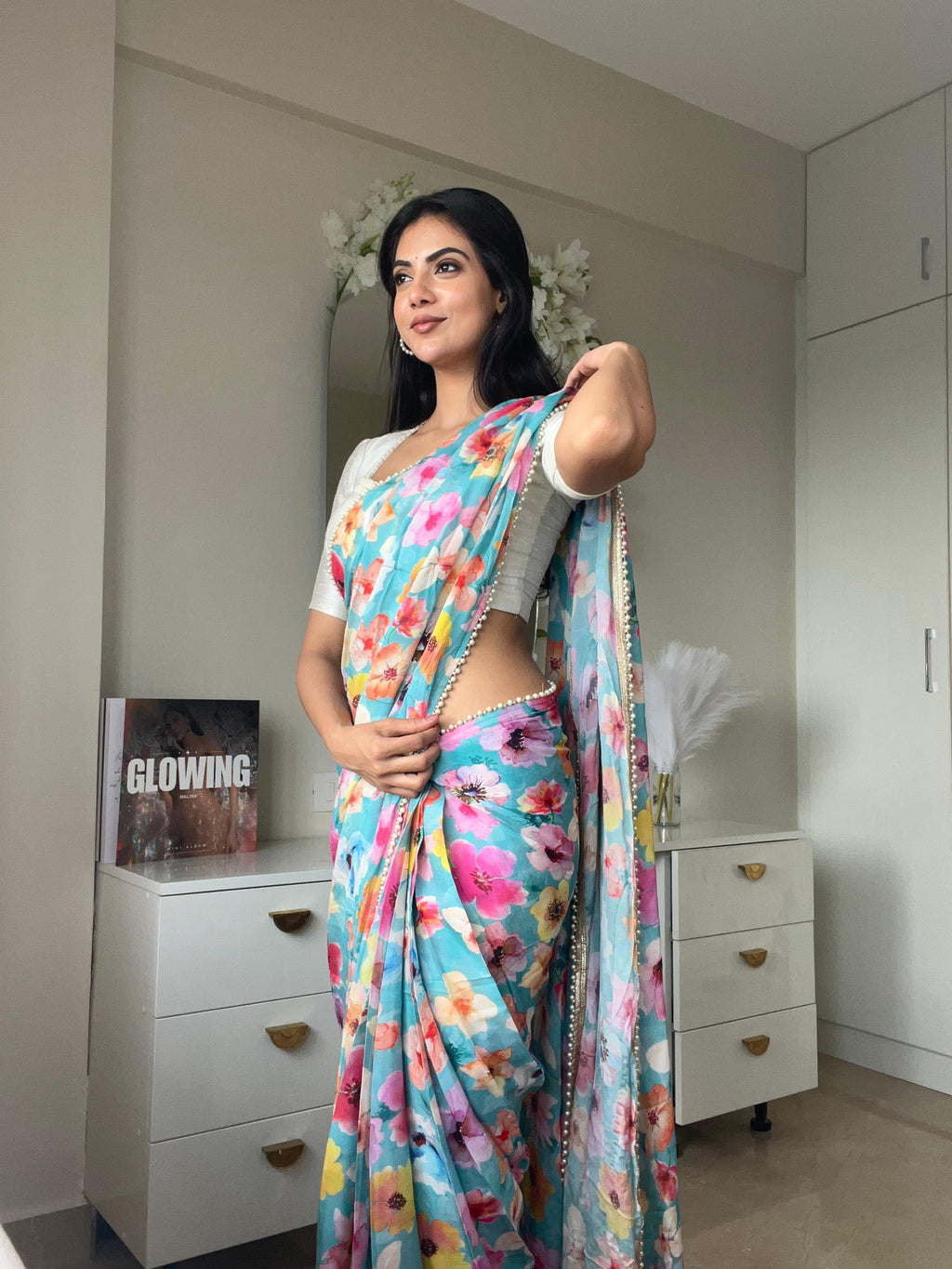 Blue floral chinnon saree with pearl hand work blouse