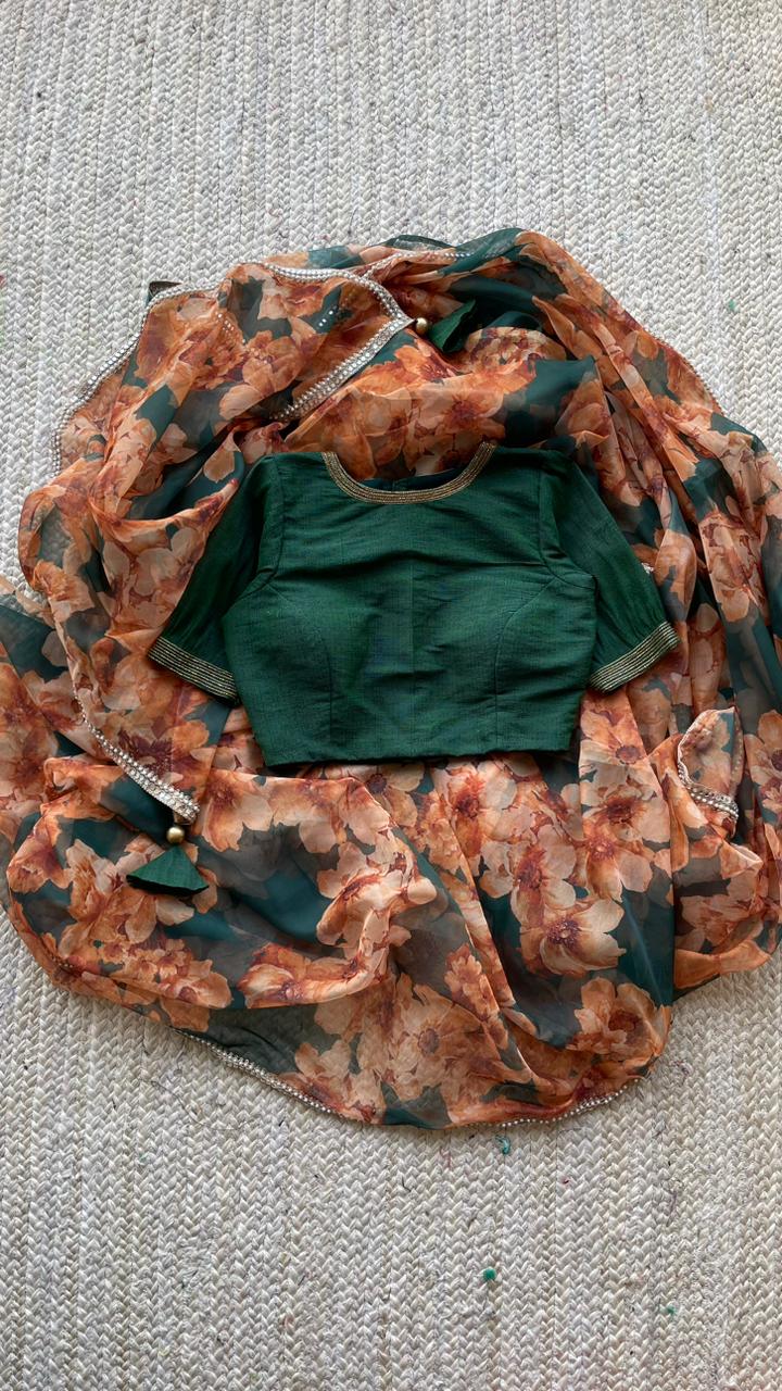 Bottle green floral organza saree with hand worked blouse
