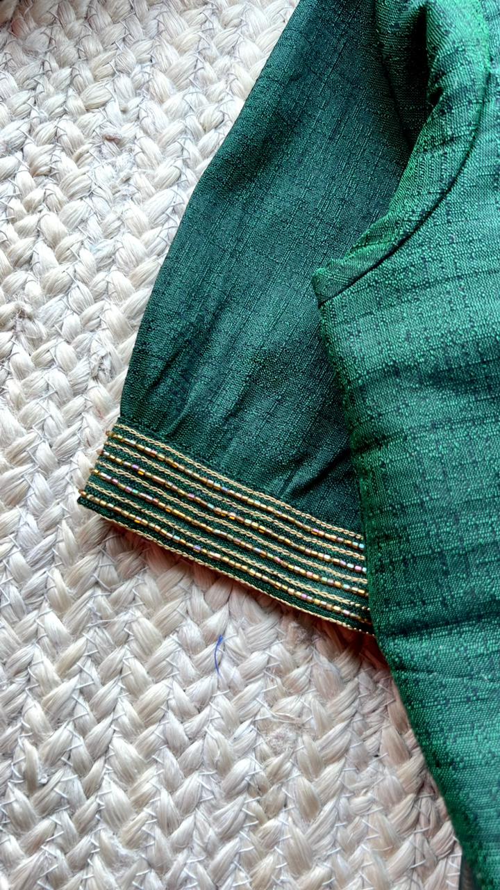 Bottle green floral organza saree with handwork blouse