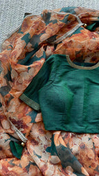 Bottle green floral organza saree with hand worked blouse