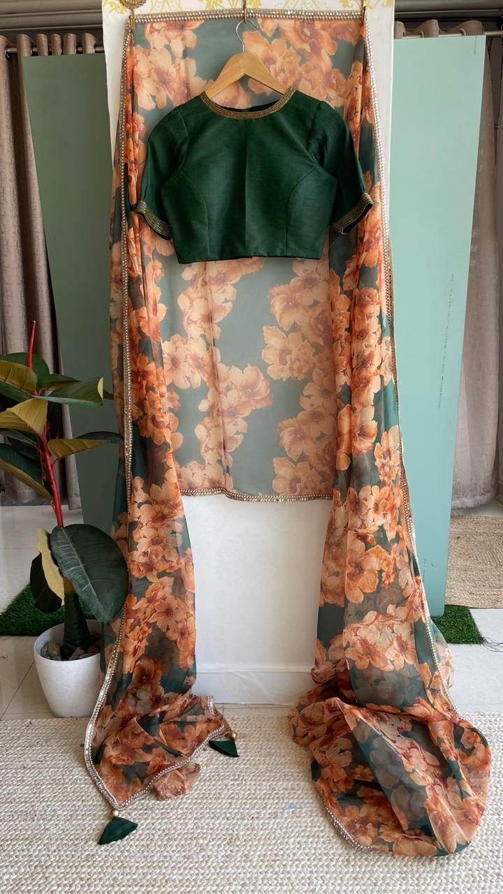 Bottle green floral organza saree with hand worked blouse