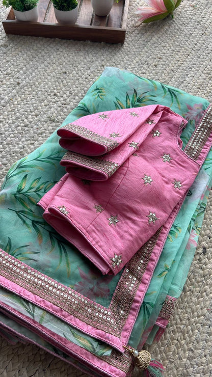 Mint green organza saree with embroidery worked blouse