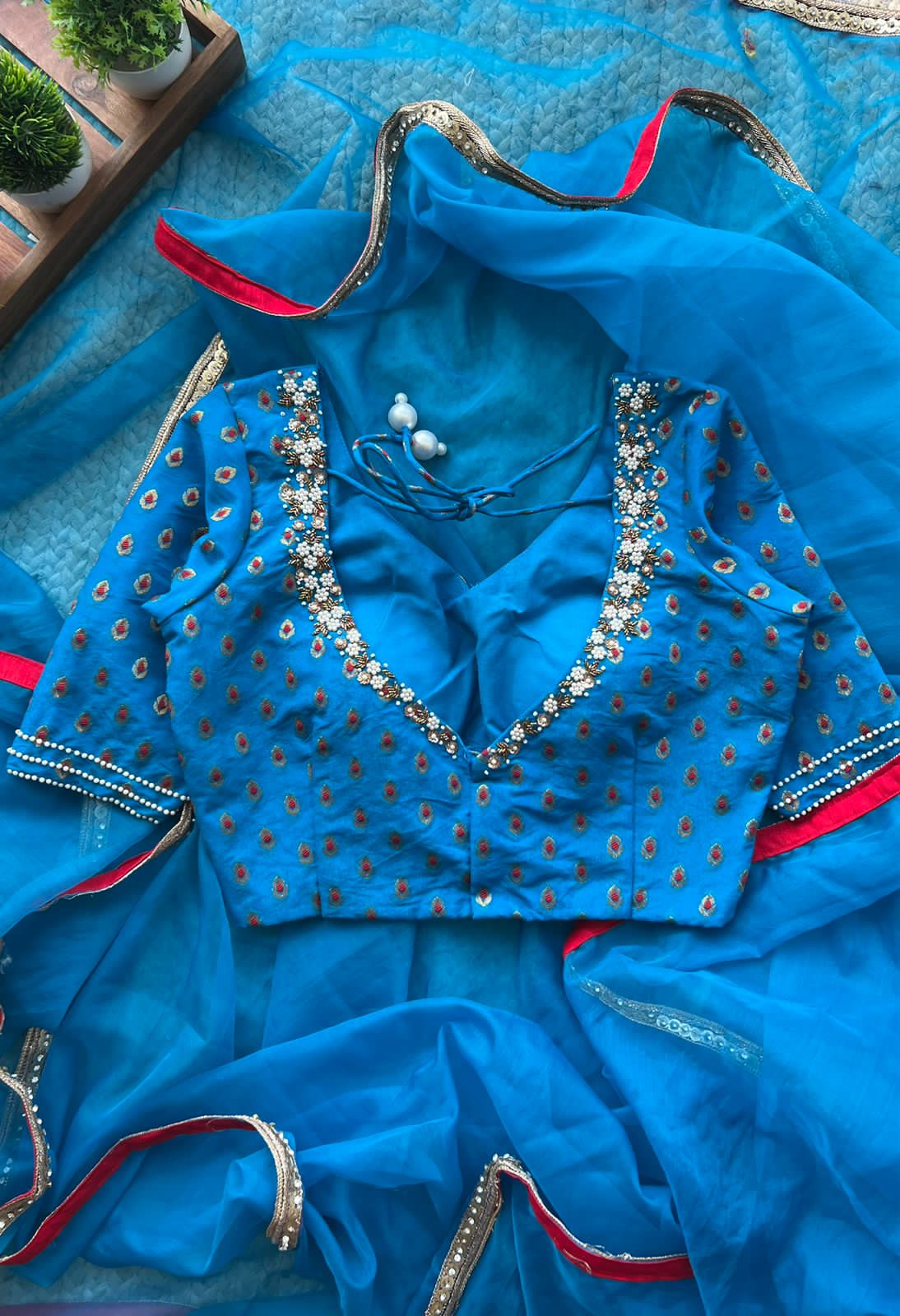 Azure blue organza saree with hand work blouse